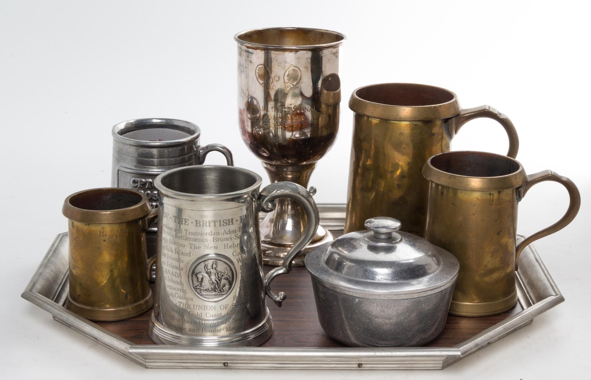 A Group of Pewter Mugs and Vessels Length of tray 17 3/4 inches.