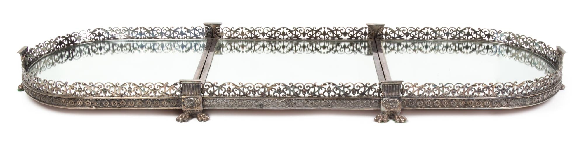 A Silvered Bronze Three-Piece Surtout de Table Height 3 5/8 x width 50 1/2 x depth 17 1/4 inches.