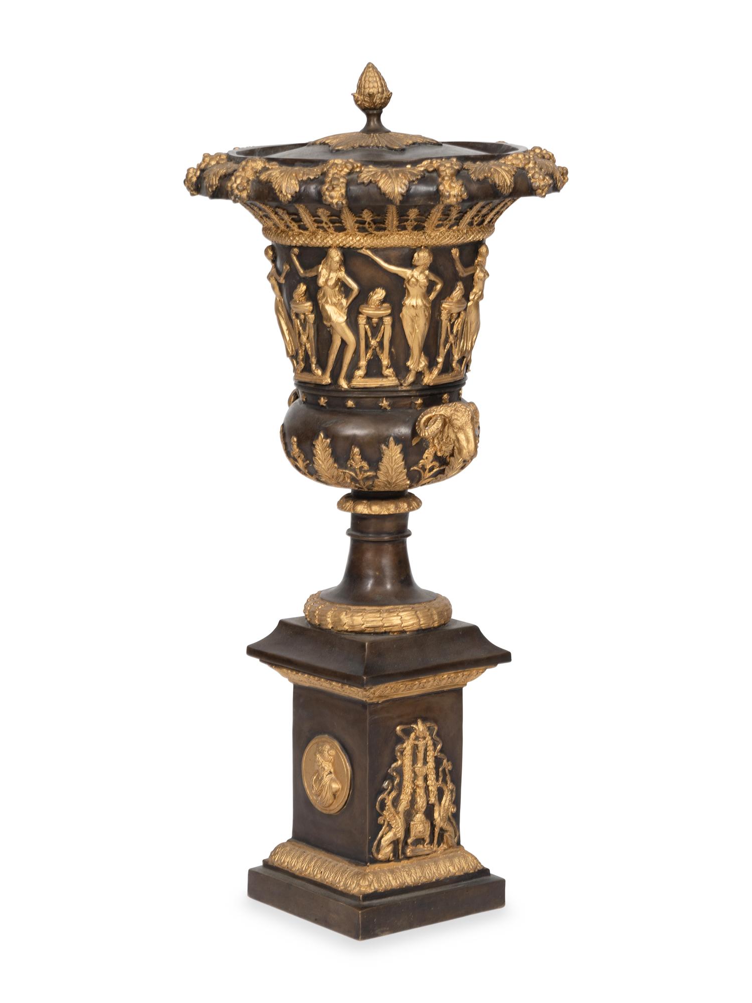 An Empire Style Cast Bronze Parcel Gilt Lidded Campagna Urn