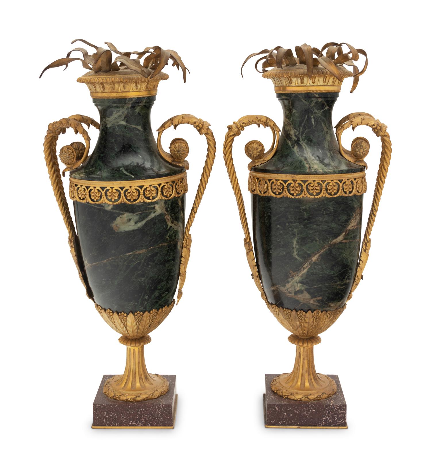 A Pair of Gilt Bronze Mounted Marble Urns on Porphyry Bases