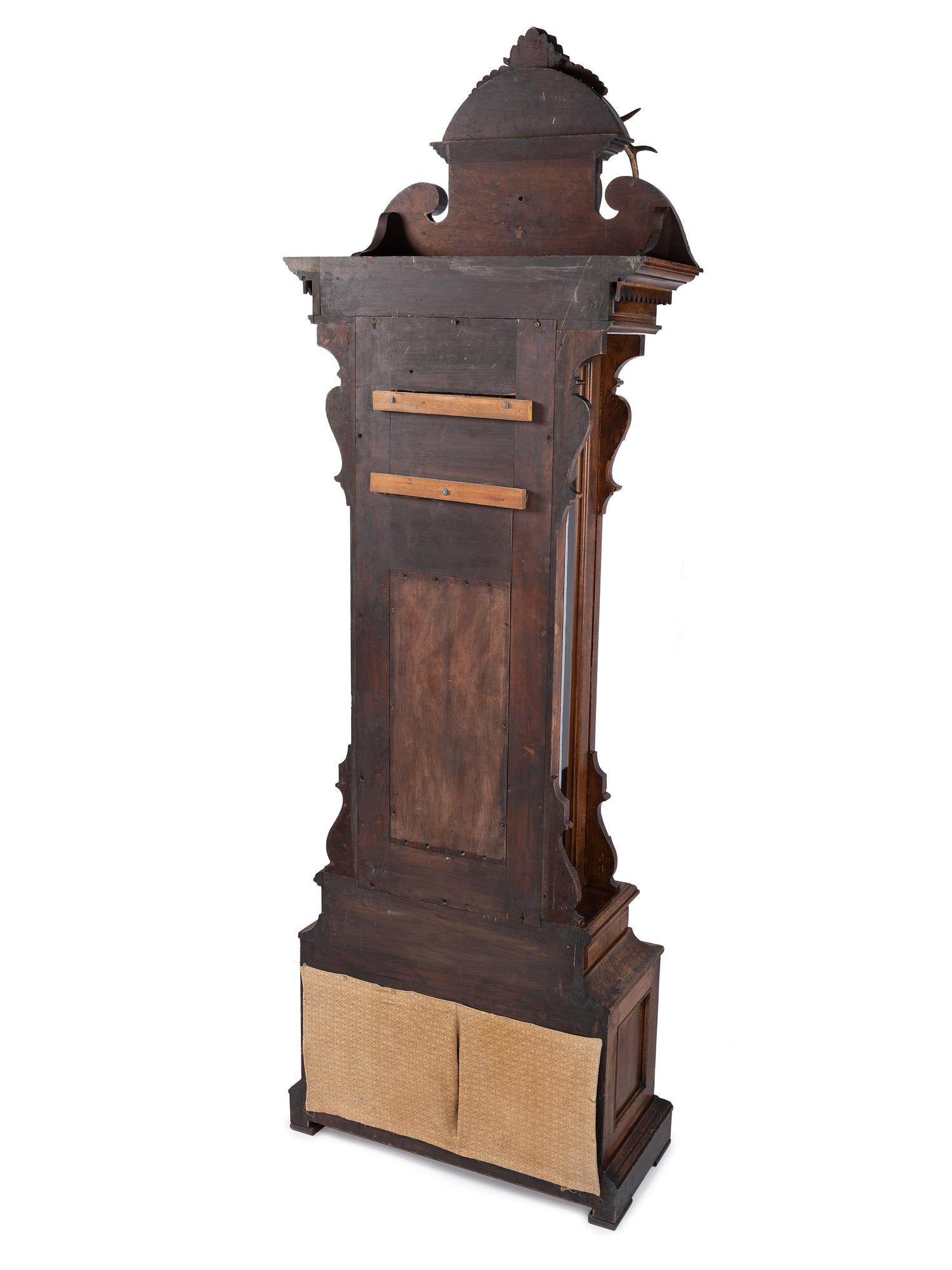 An Impressive Renaissance Revival Carved Walnut Tall Case Regulator Clock