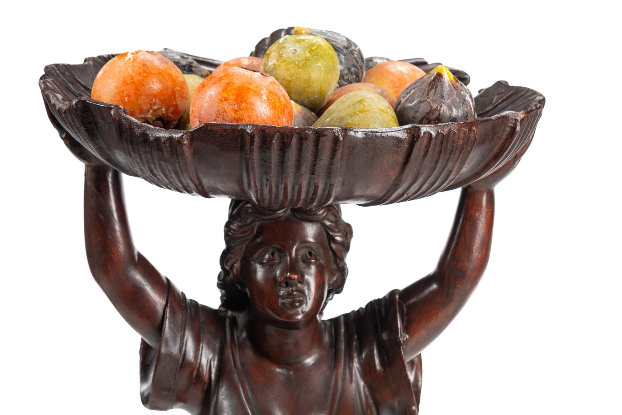 A Venetian Style Carved Walnut Figural Stand