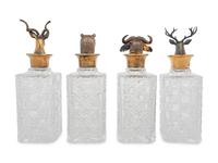 A Set of Four English Silver Mounted Cut-Glass Decanters