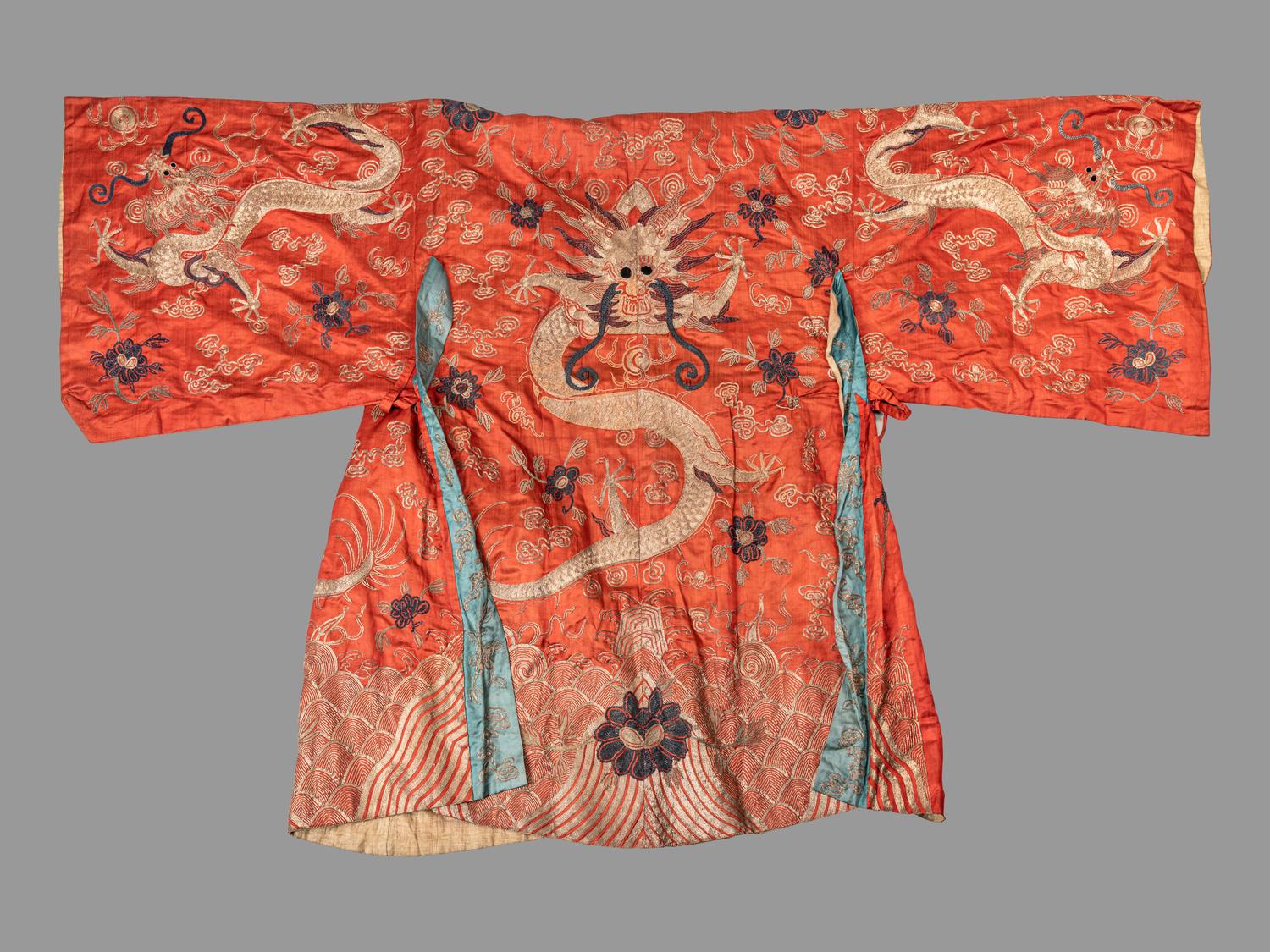 A Chinese Orange Ground Embroidered Silk Theatrical Dragon Robe