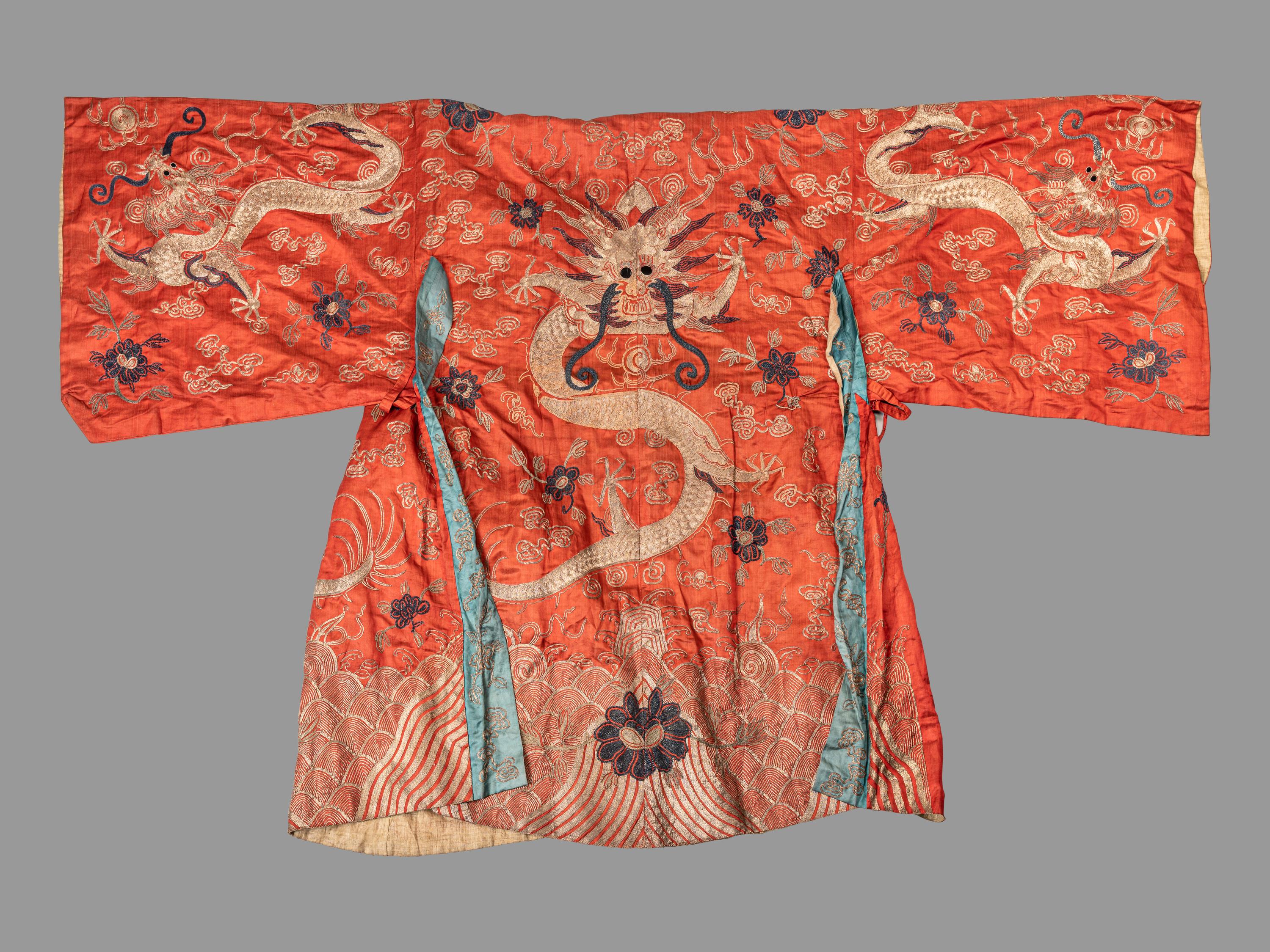 A Chinese Orange Ground Embroidered Silk Theatrical Dragon Robe