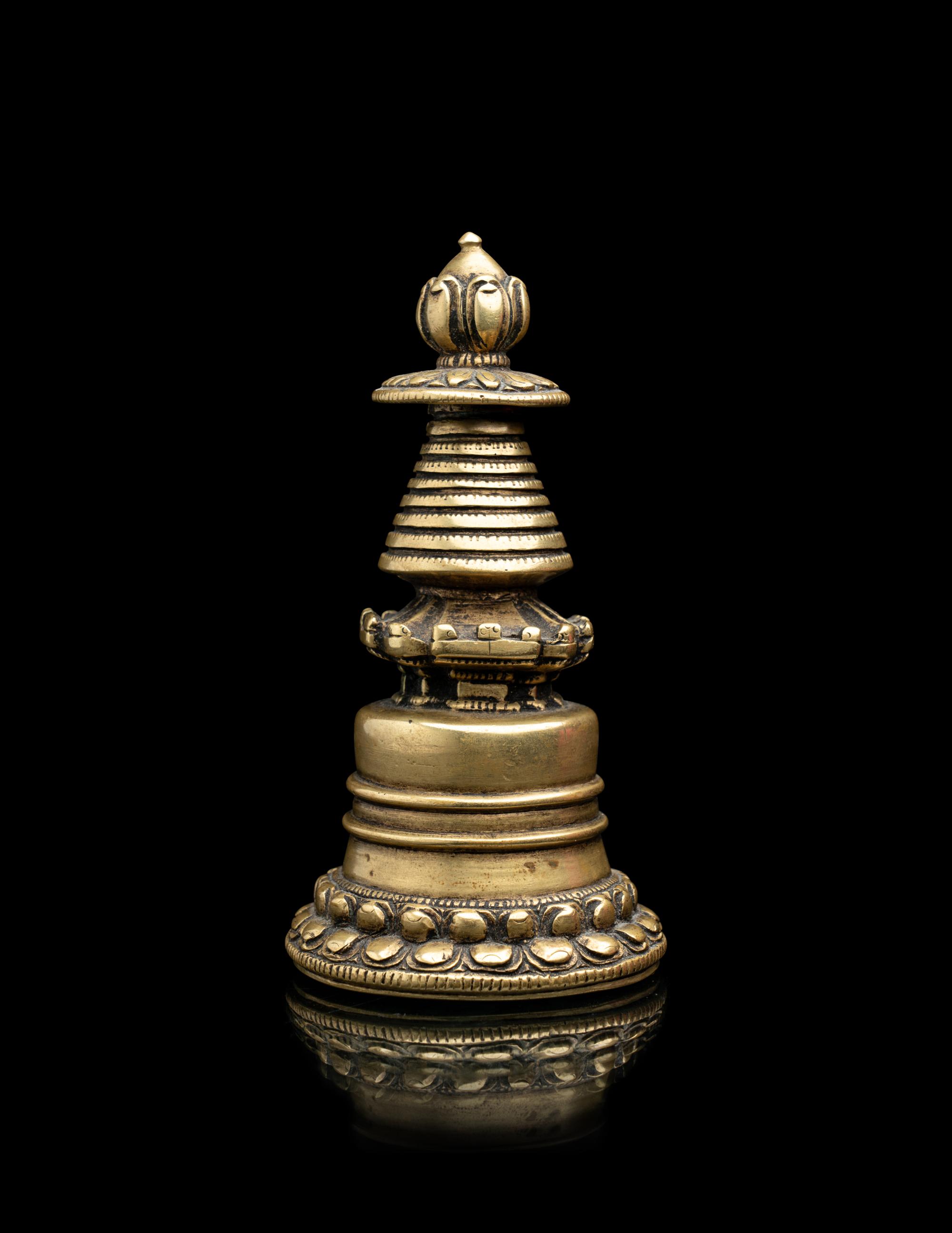 A Small Tibetan Bronze Pala-Style Model of a Stupa