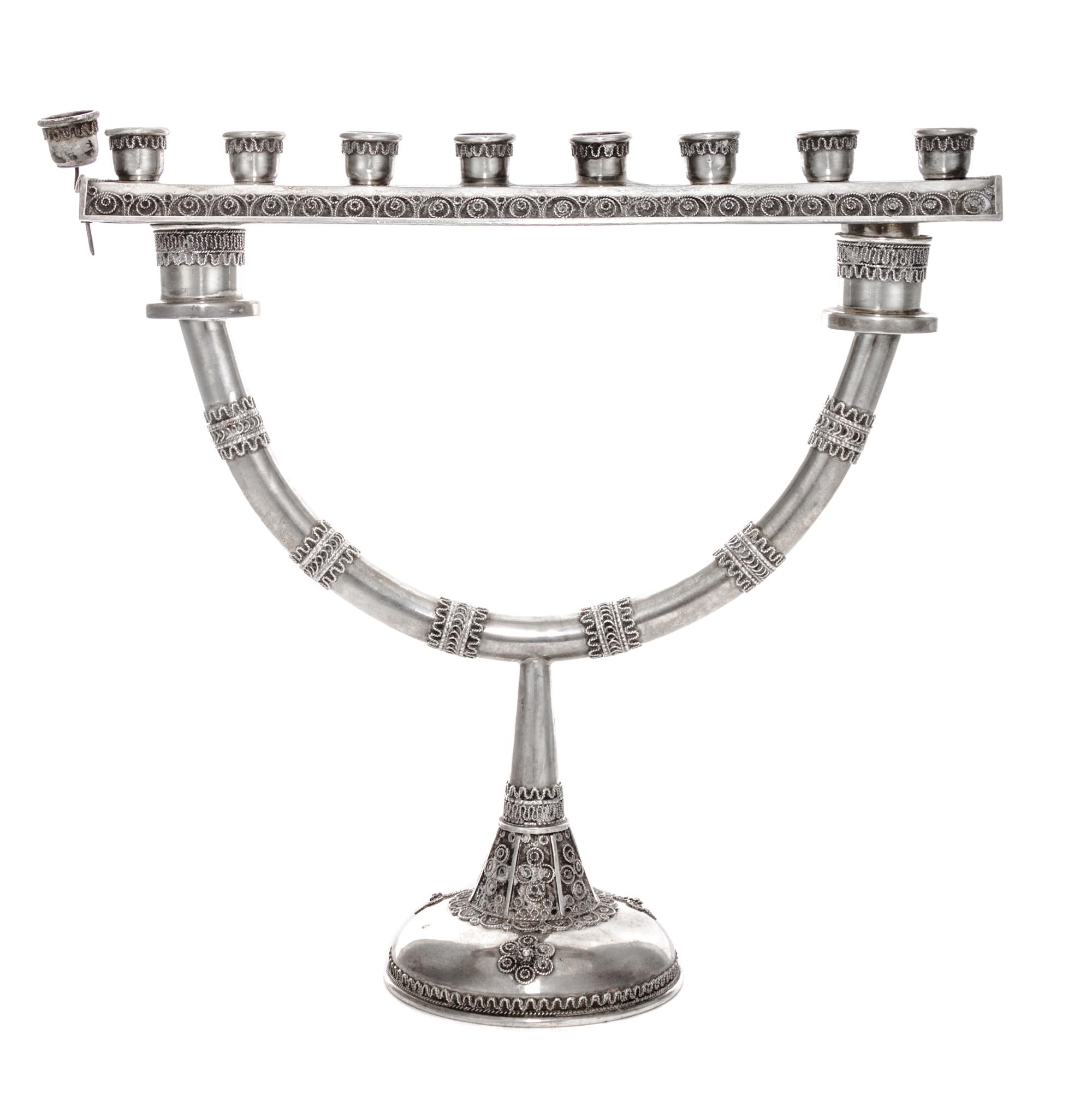 An Israeli Silver Menorah and Sabbath Candelabrum, 20th Century, the detachable top having an eight candle bench with wireworked decora