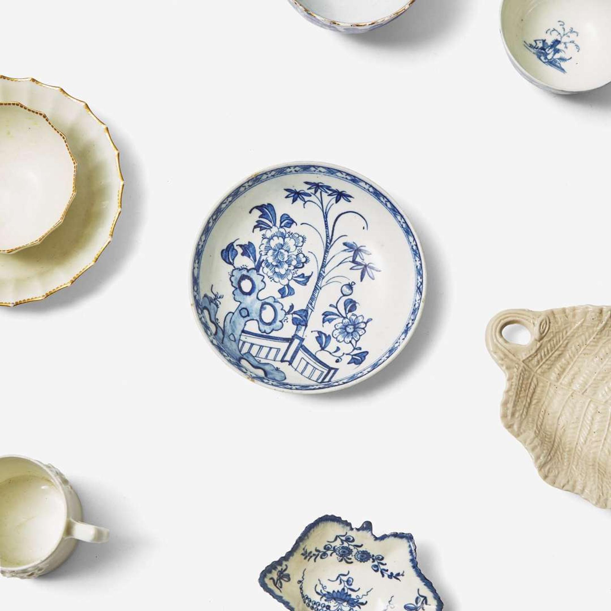 An assorted group of twenty-eight English soft paste porcelain and salt-glazed stoneware tablewares Various makers, 18th century