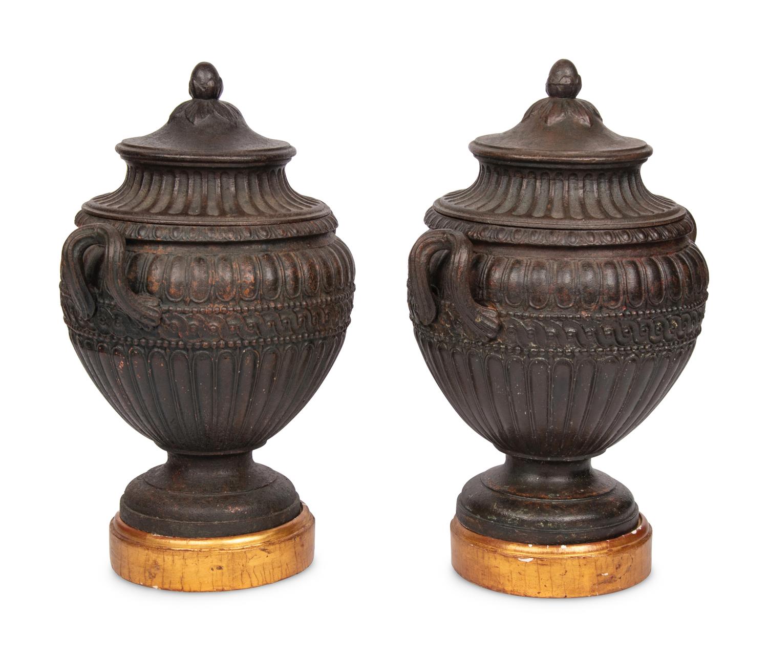 A Pair of Continental Cast Iron Urns