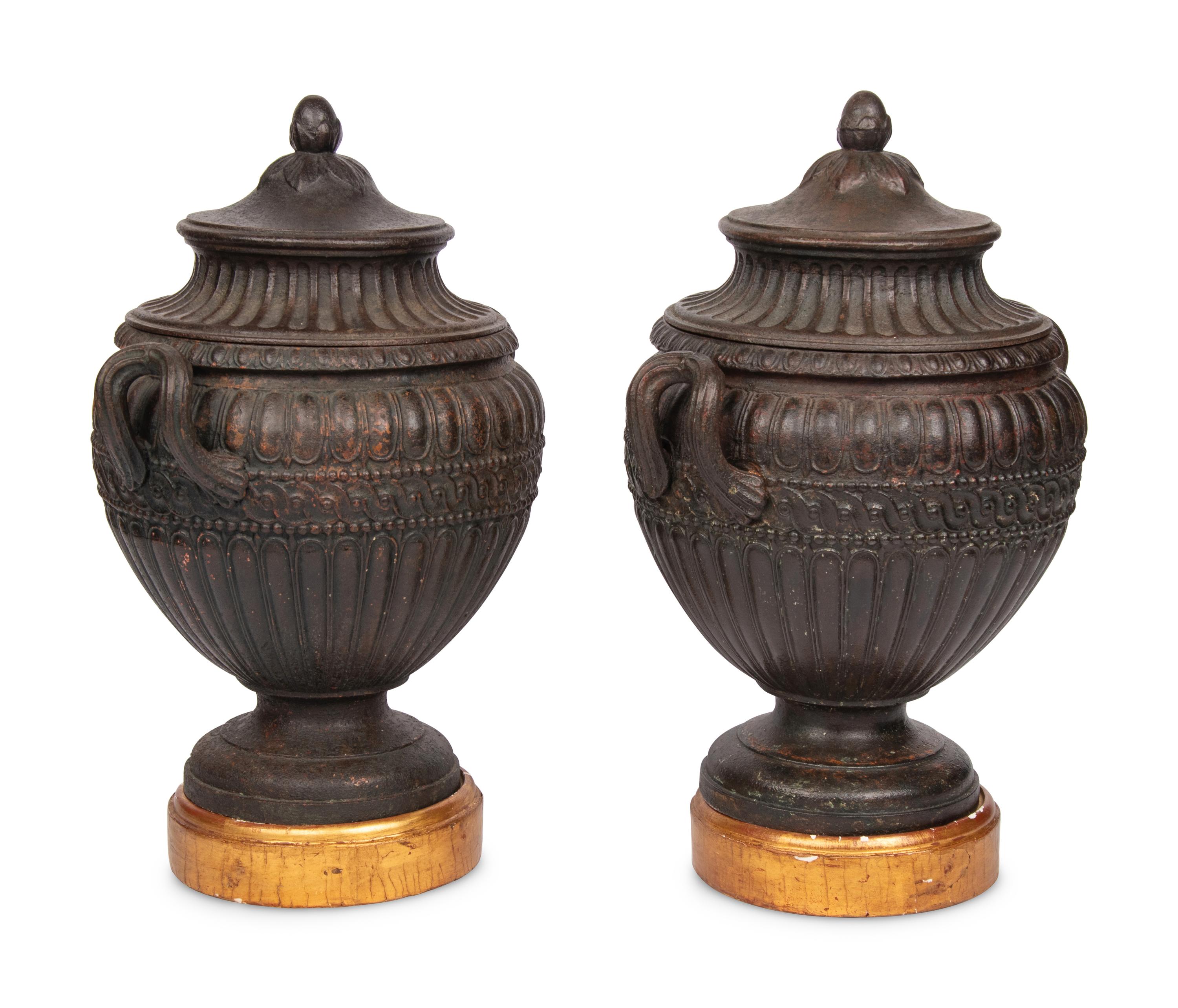 A Pair of Continental Cast Iron Urns
