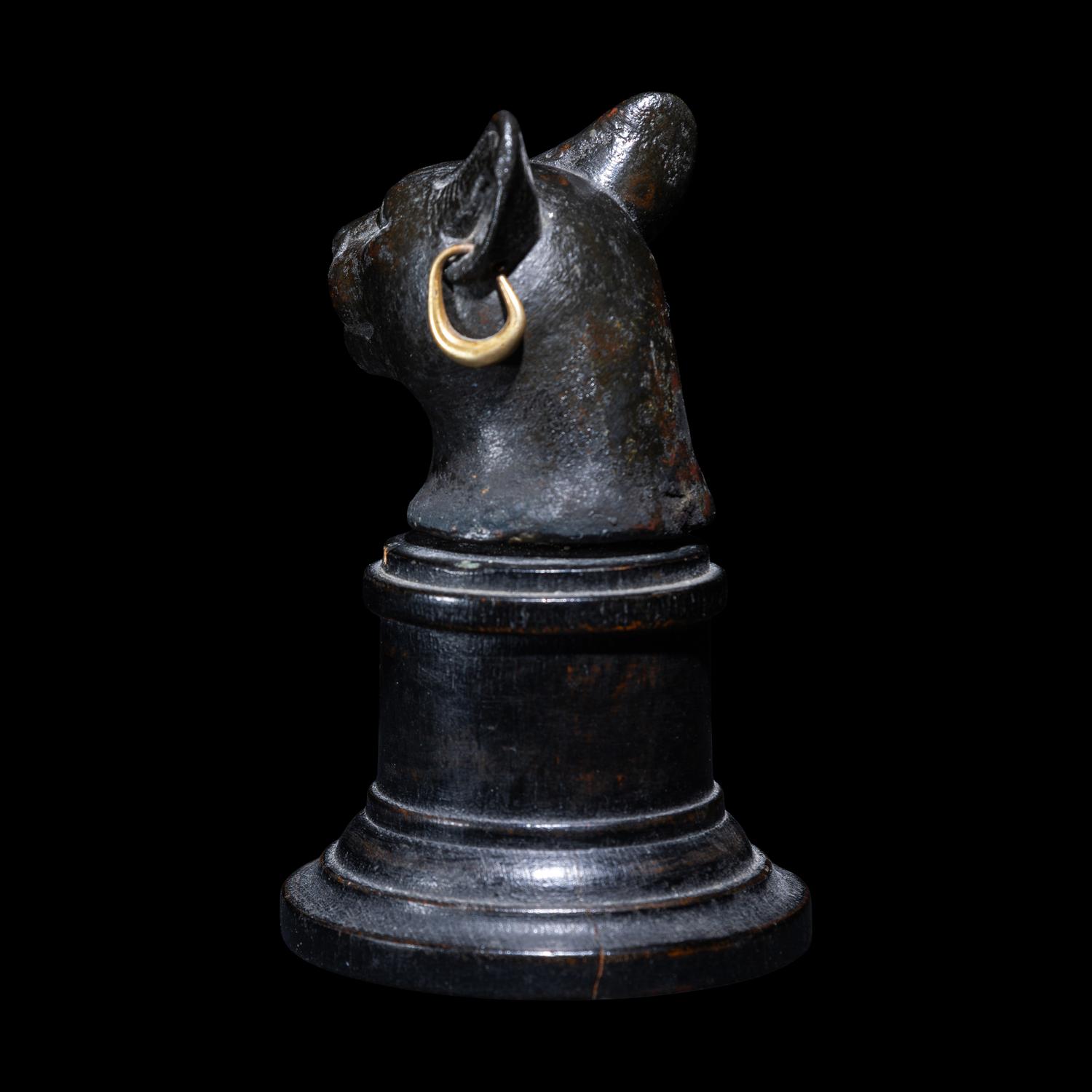 An Egyptian Bronze Head of a Cat