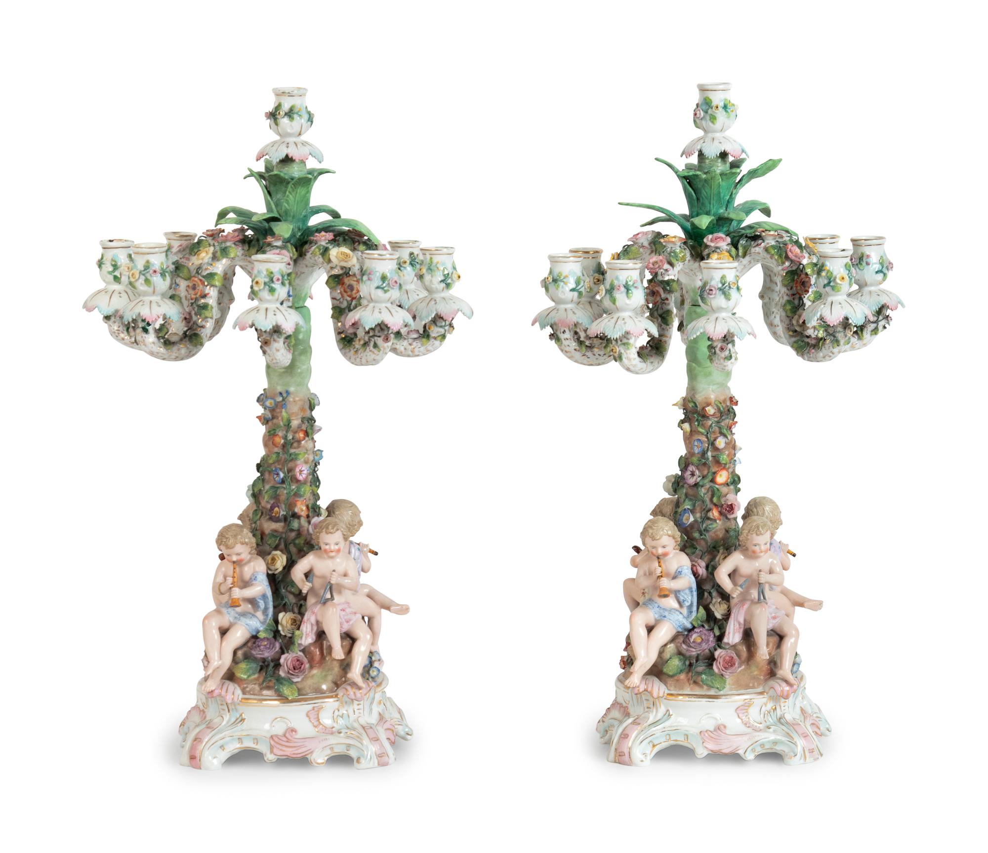 A Pair of Continental Porcelain Figural Candelabra