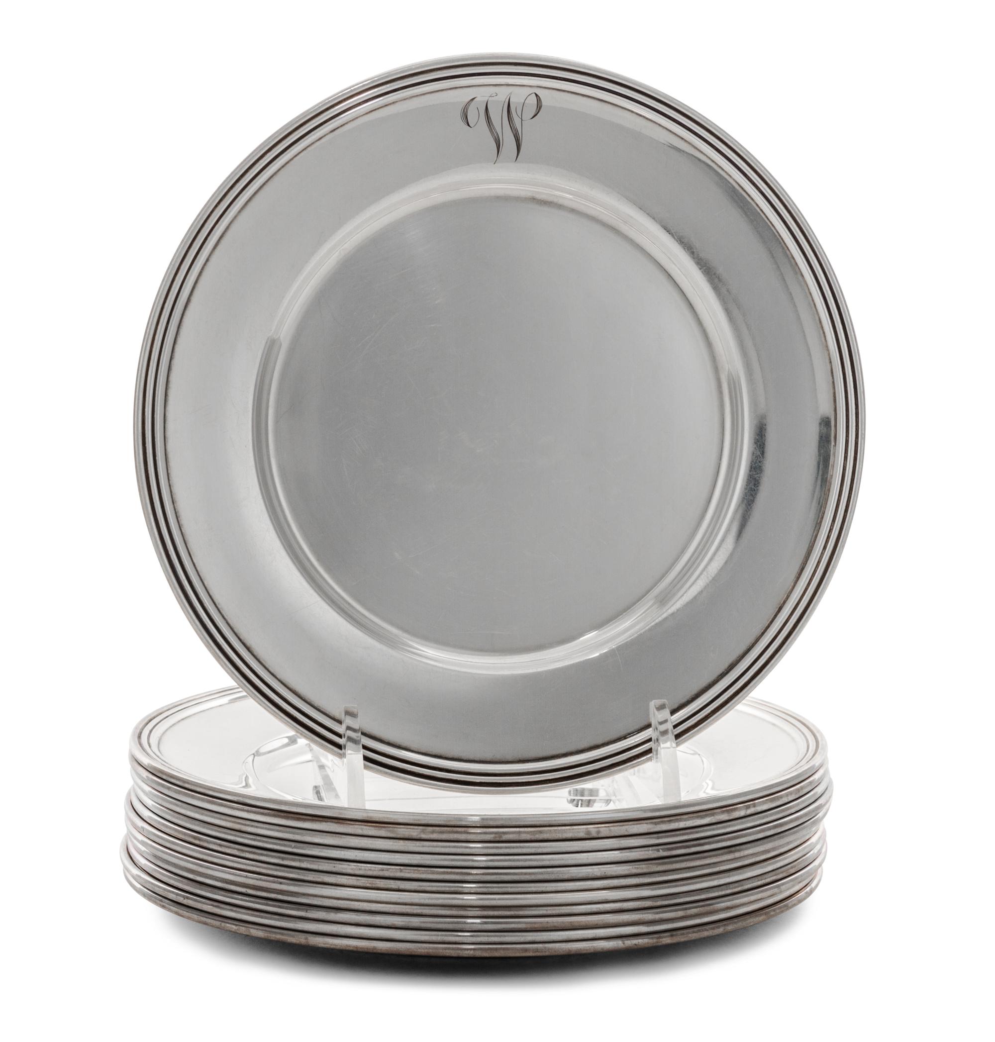 A Set of Twelve American Silver Bread Plates, Manchester Silver Co., Providence, RI, 20th Century, each with a reeded edge.