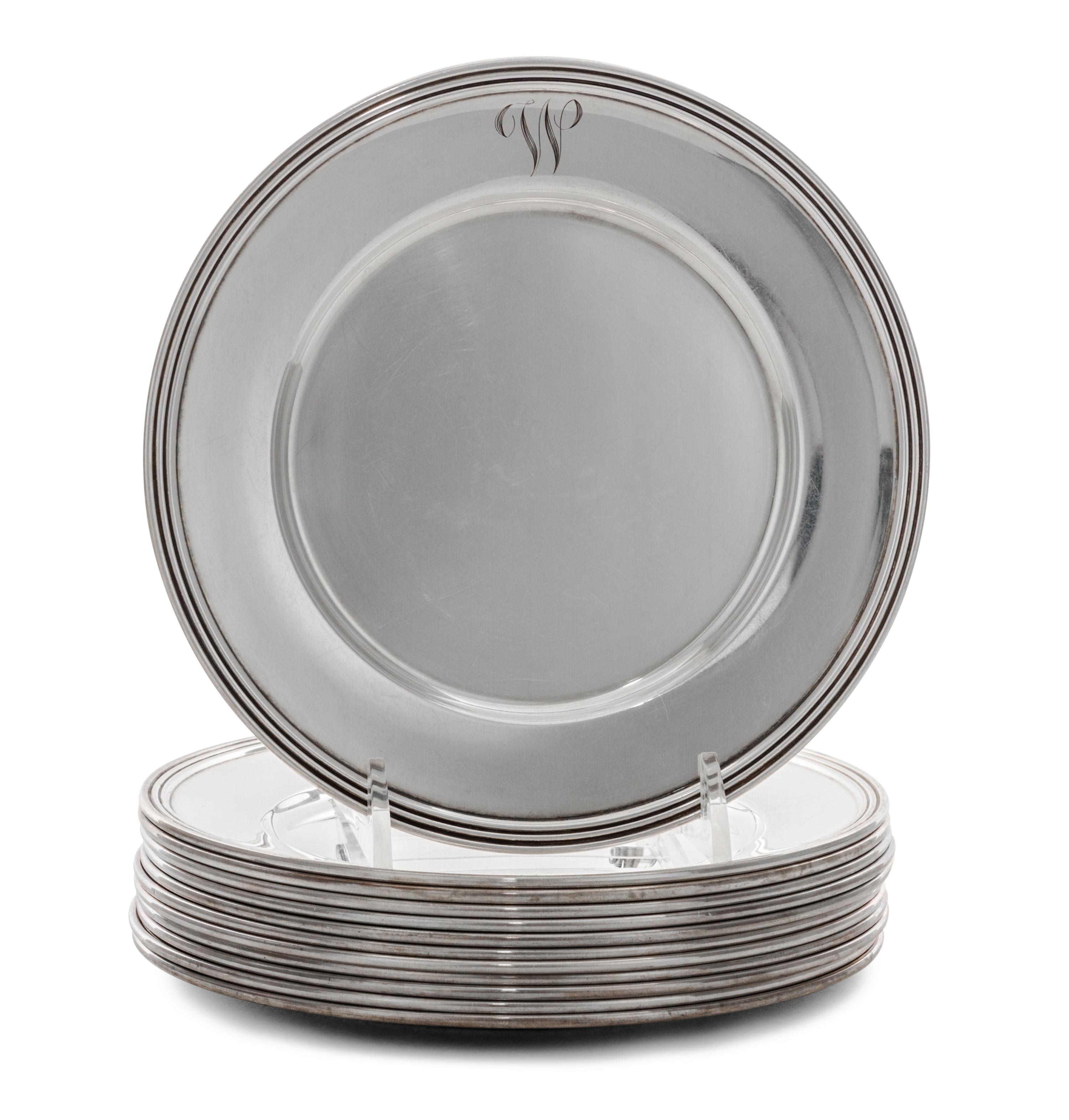 A Set of Twelve American Silver Bread Plates, Manchester Silver Co., Providence, RI, 20th Century, each with a reeded edge.