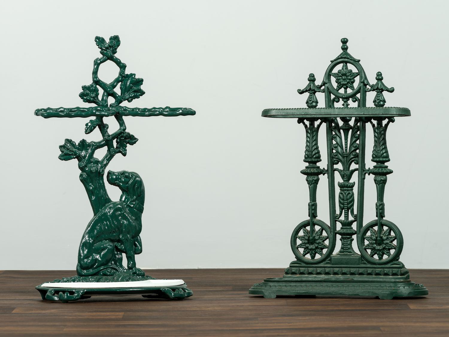 Two Green Painted Cast-Iron Umbrella Stands