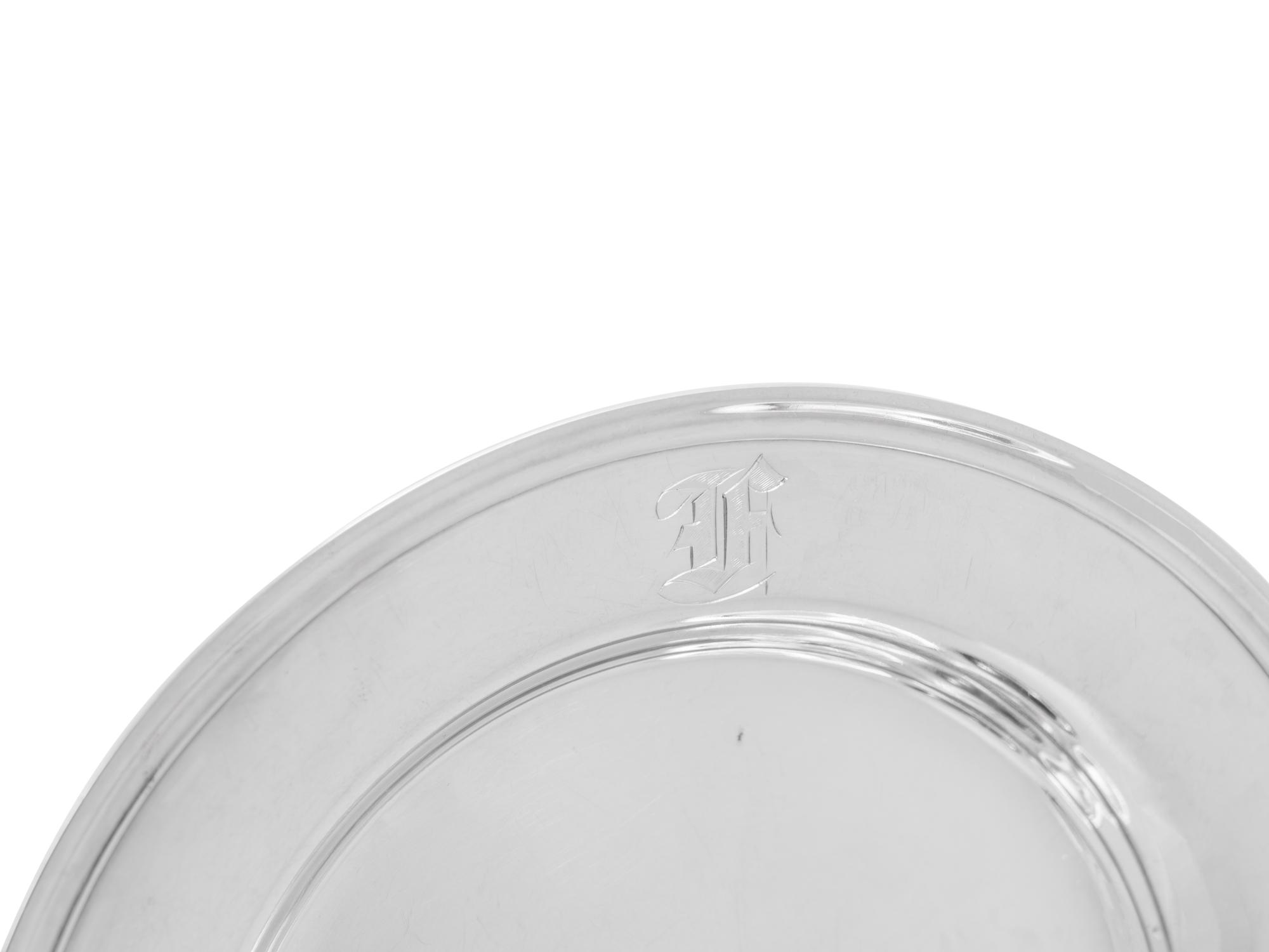A Set of Sixteen American Silver Bread Plates