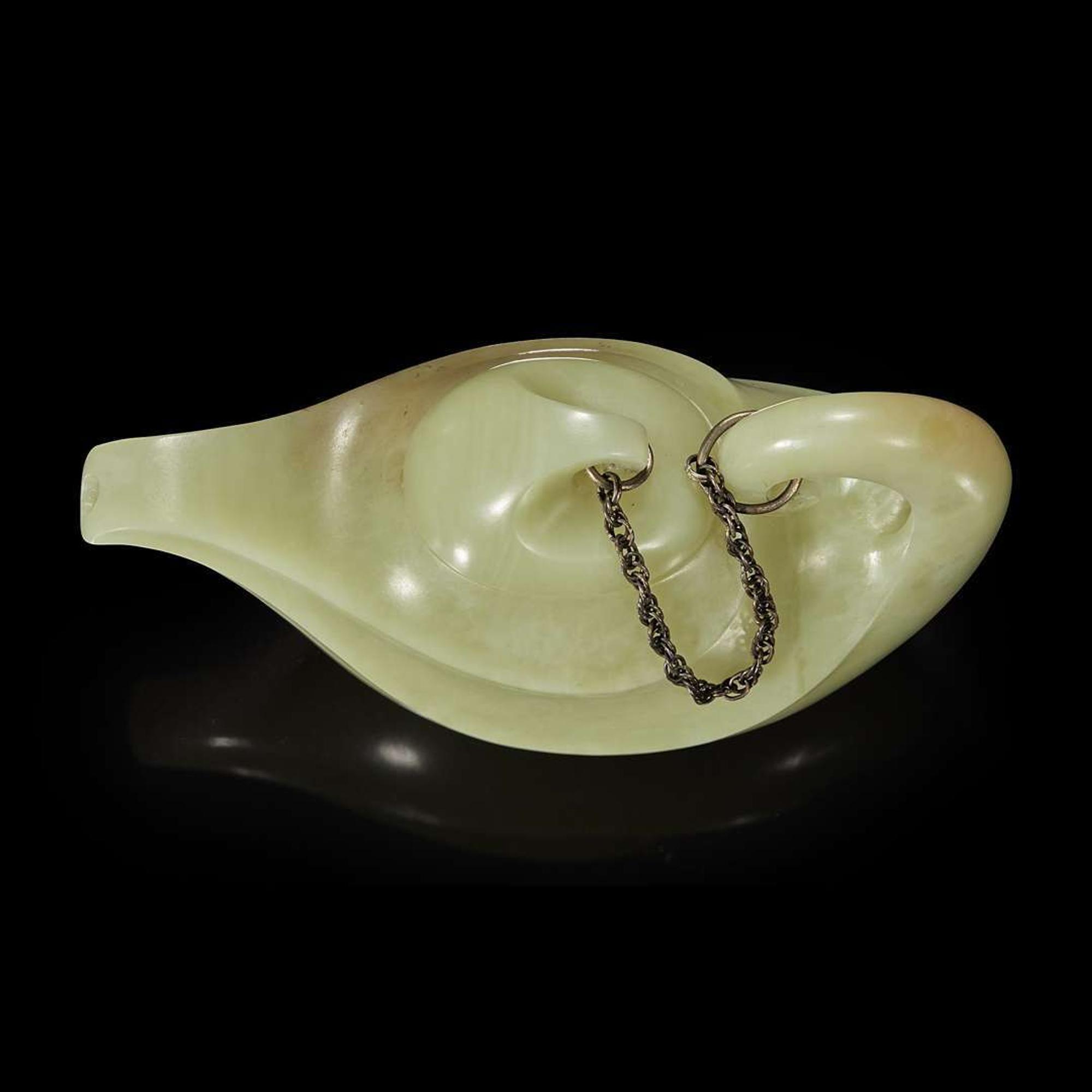 A Chinese yellowish-celadon jade teapot and cover 青黄玉雕带盖茶壶