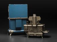 A Qualified Range Co. Salesman Sample Stove and a Rival Toy Stove