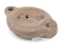 A Roman Discus Lamp Depicting Dionysos Holding a Thyrsos and a Bunch of Grapes
