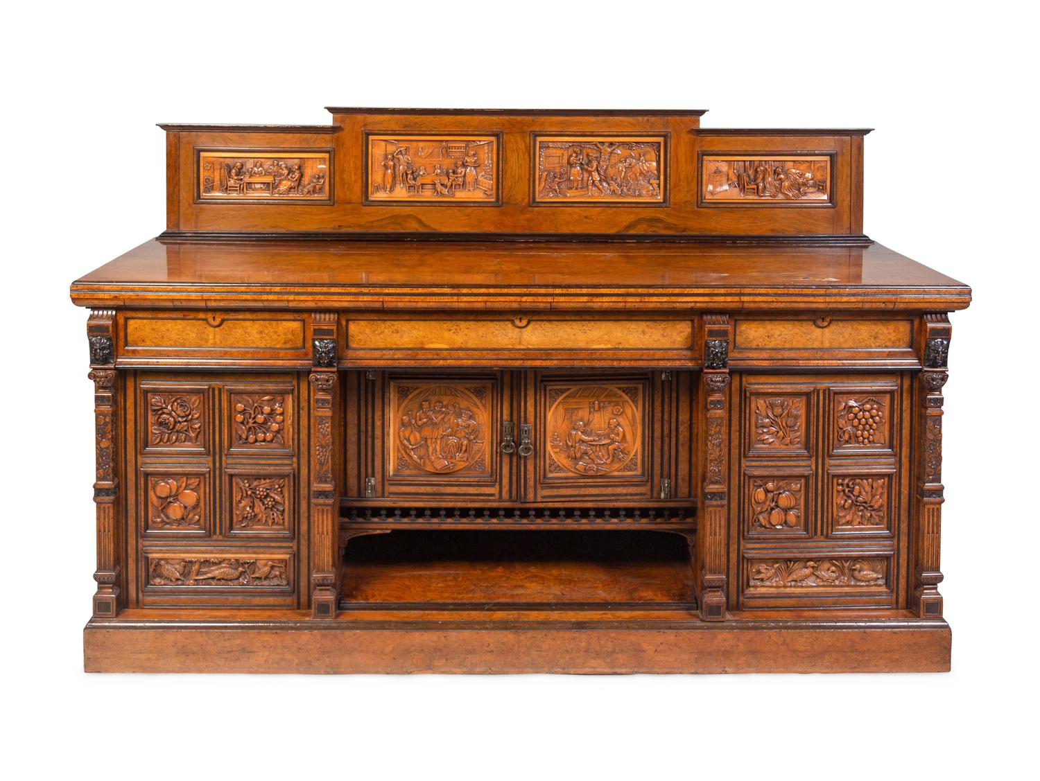 A Continental Carved Walnut and Burlwood Serving Cabinet