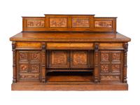 A Continental Carved Walnut and Burlwood Serving Cabinet