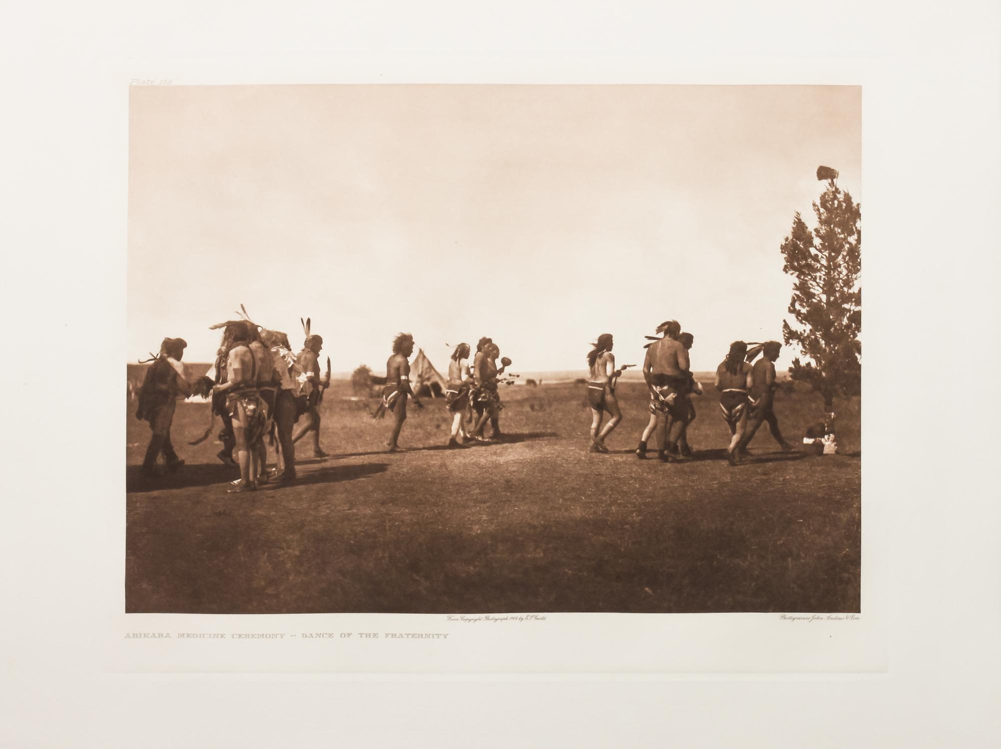 Edward Sheriff Curtis, (American, 1868-1952), three photogravuresShot in the Hand-Apsaroke Plate 133, Arikara Medicine Fraternity Plate