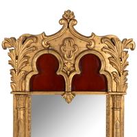A Gothic Revival Giltwood and Gesso Pier Glass.