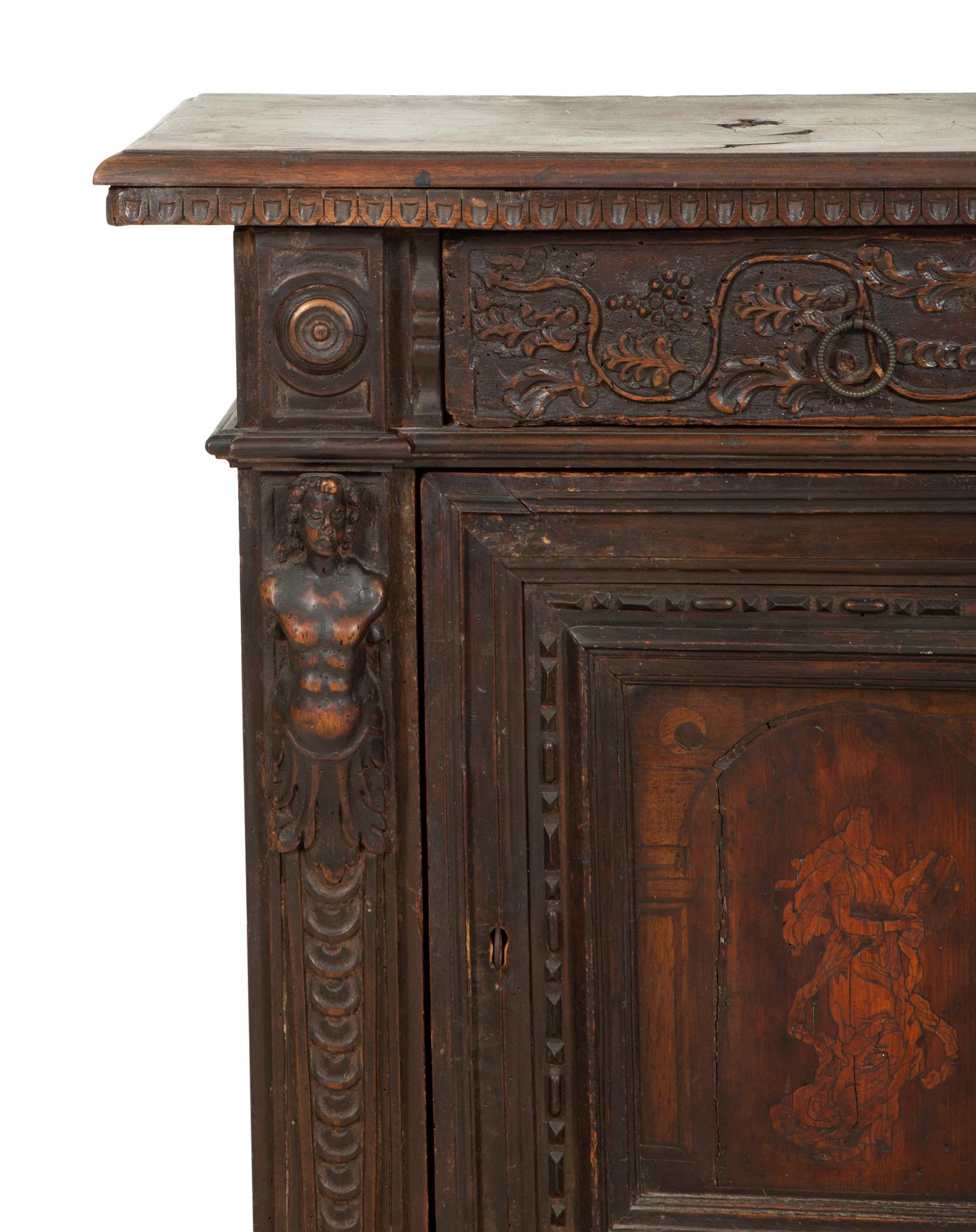 An Italian Carved Walnut Side Cabinet with Marquetry Panel Door