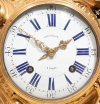 A Louis XV Gilt Bronze Cartel Clock