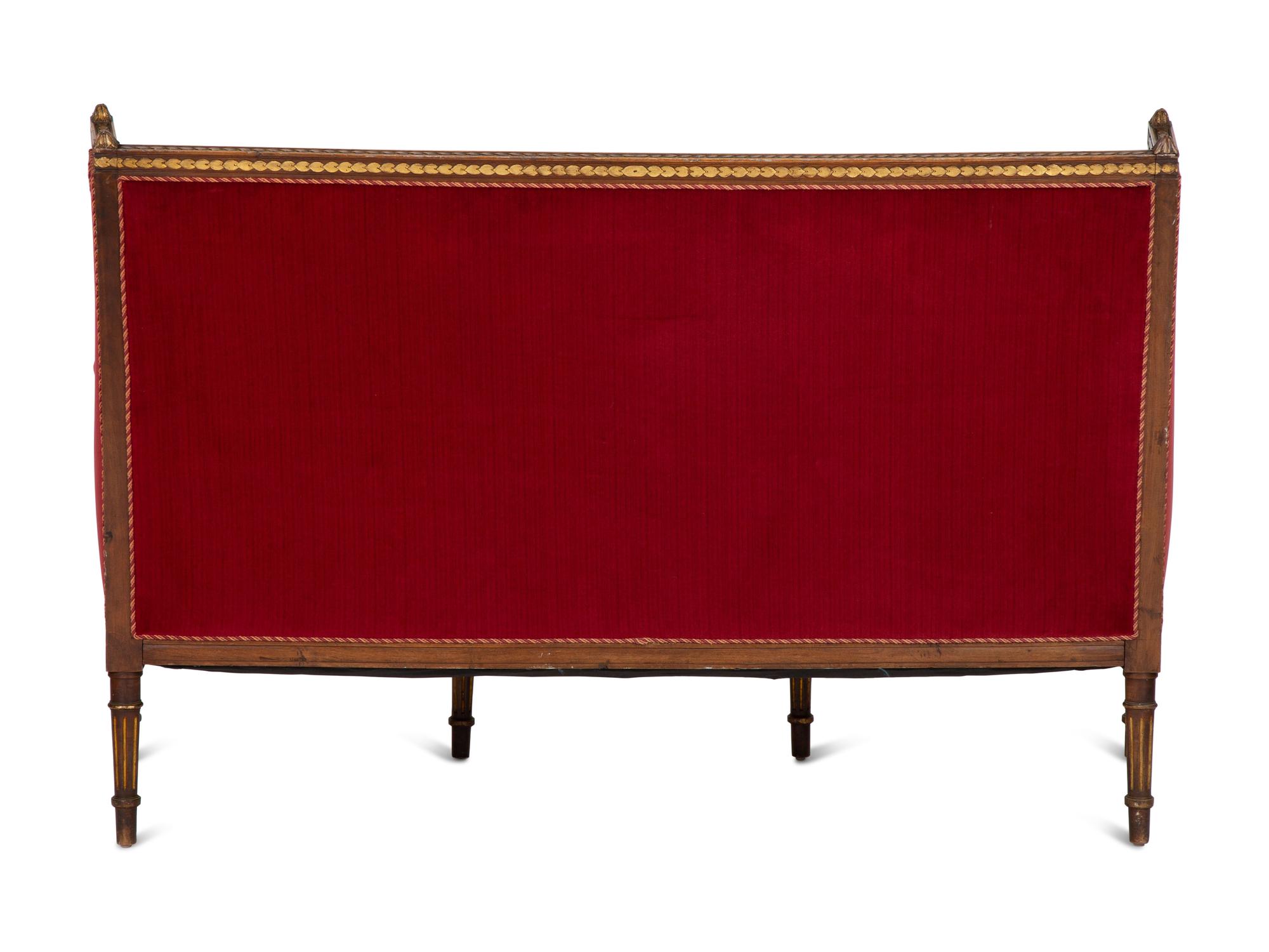 A Louis XVI Style Parcel Gilt Walnut Sofa