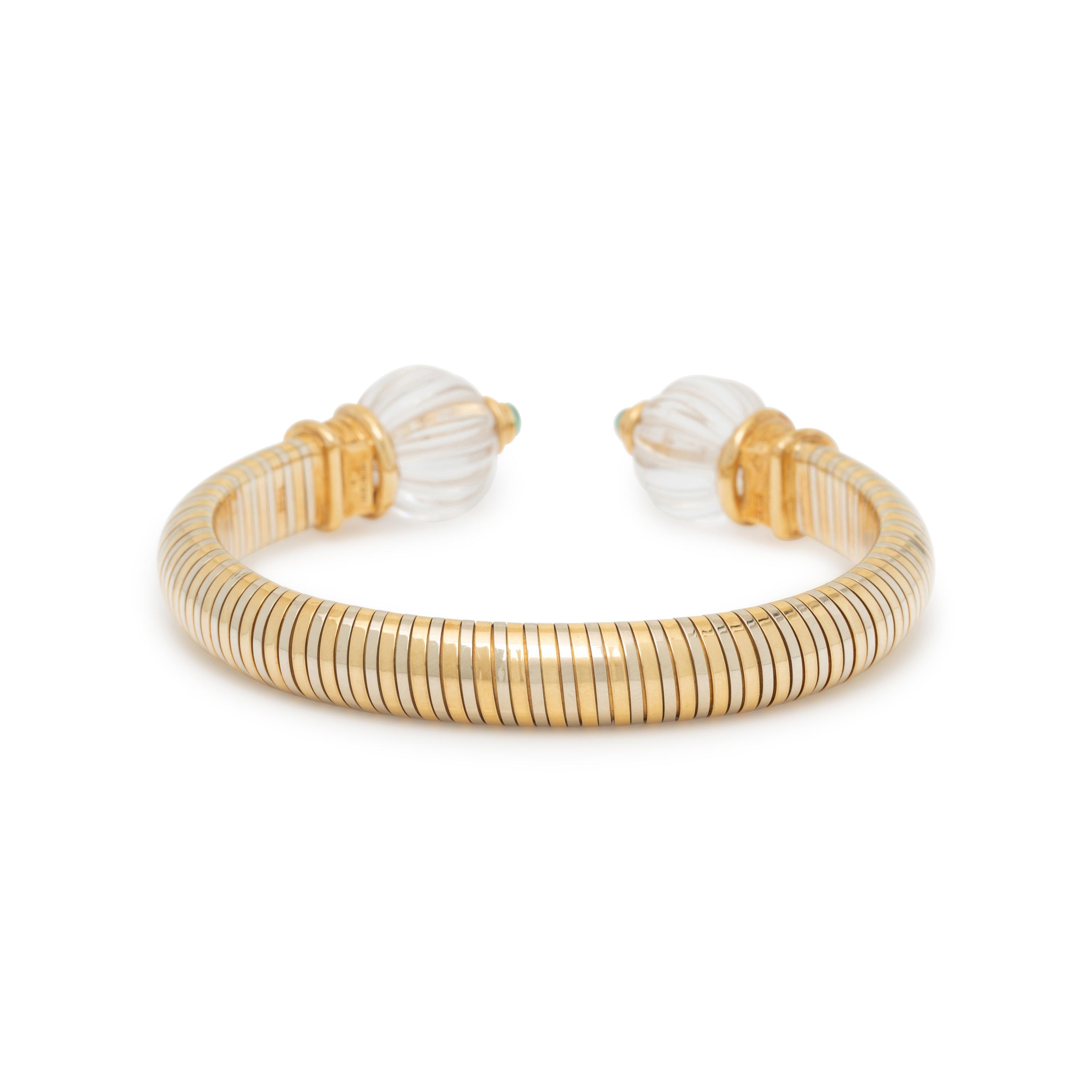 BOUCHERON, BICOLOR GOLD, ROCK CRYSTAL, AND EMERALD CUFF BRACELET