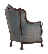 A Pair of Carved Walnut Armchairs in the Style of Karpen Bros.