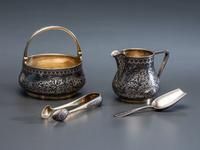 A Russian Niello Inlaid Silver Four-Piece Serving Set