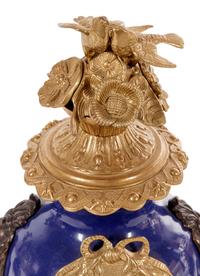 A Napoleon III Style Gilt Bronze Mounted Cobalt Porcelain Clock Garniture