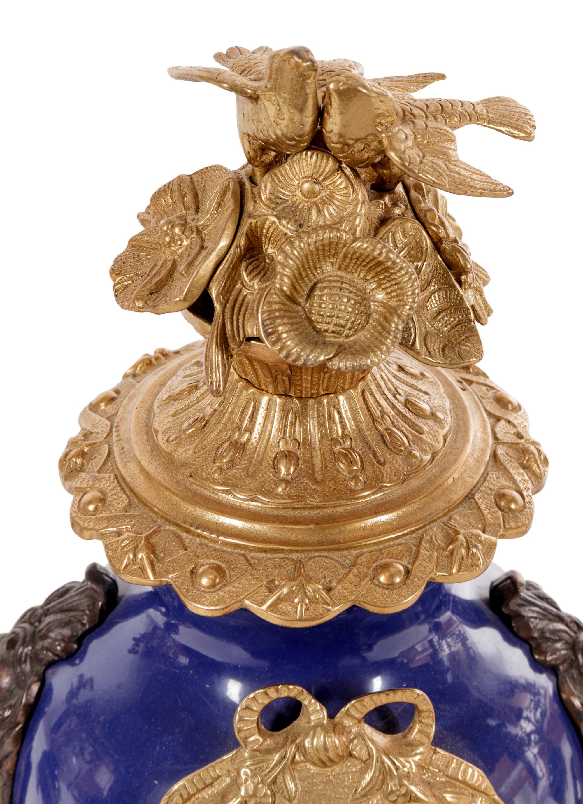 A Napoleon III Style Gilt Bronze Mounted Cobalt Porcelain Clock Garniture