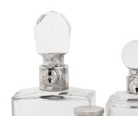 Seven Silver and Silver-Plate Mounted Glass Decanters
