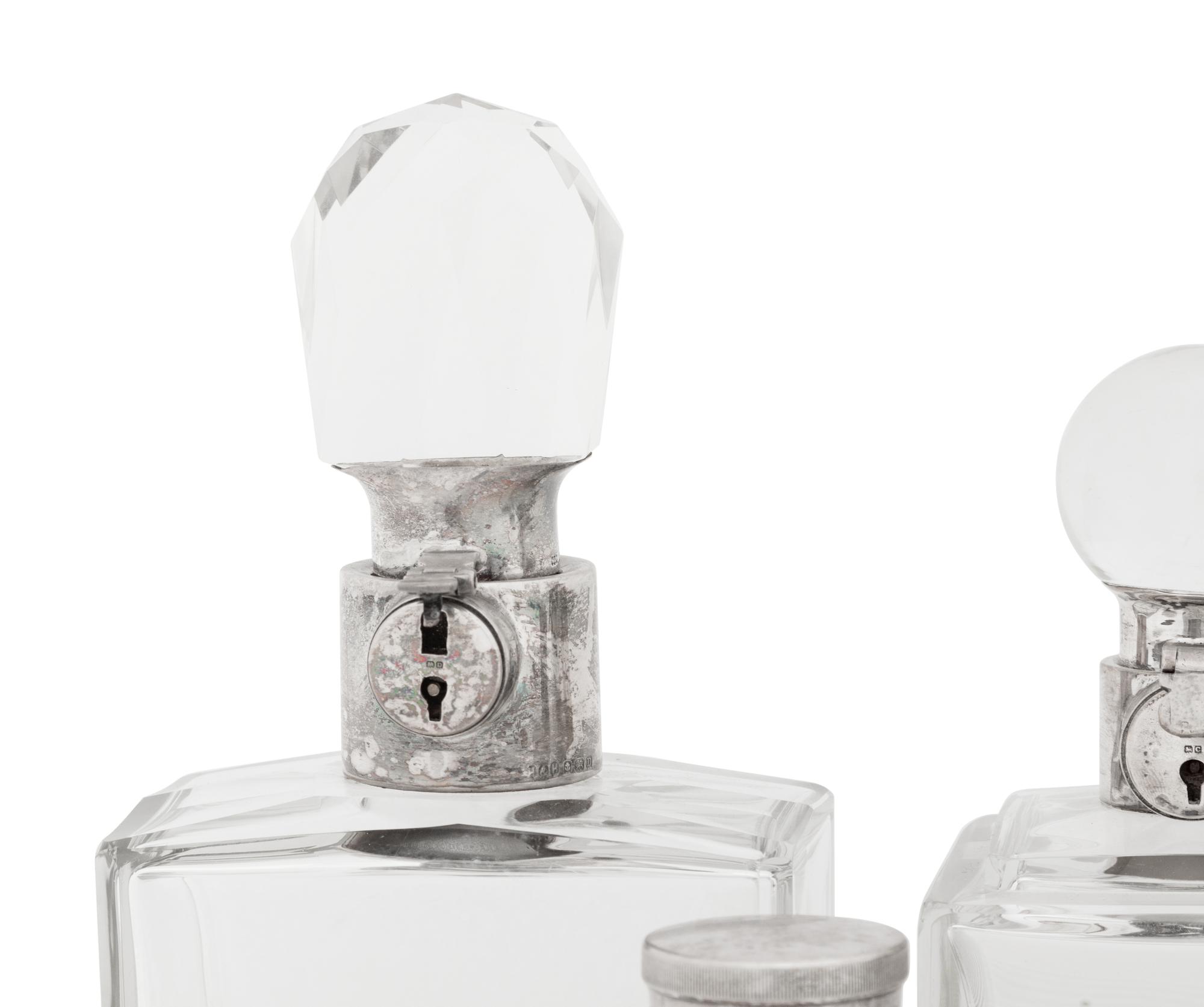 Seven Silver and Silver-Plate Mounted Glass Decanters