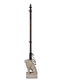A Cast Stone Seated Lion with Iron Flag Pole in the Manner of Mizner