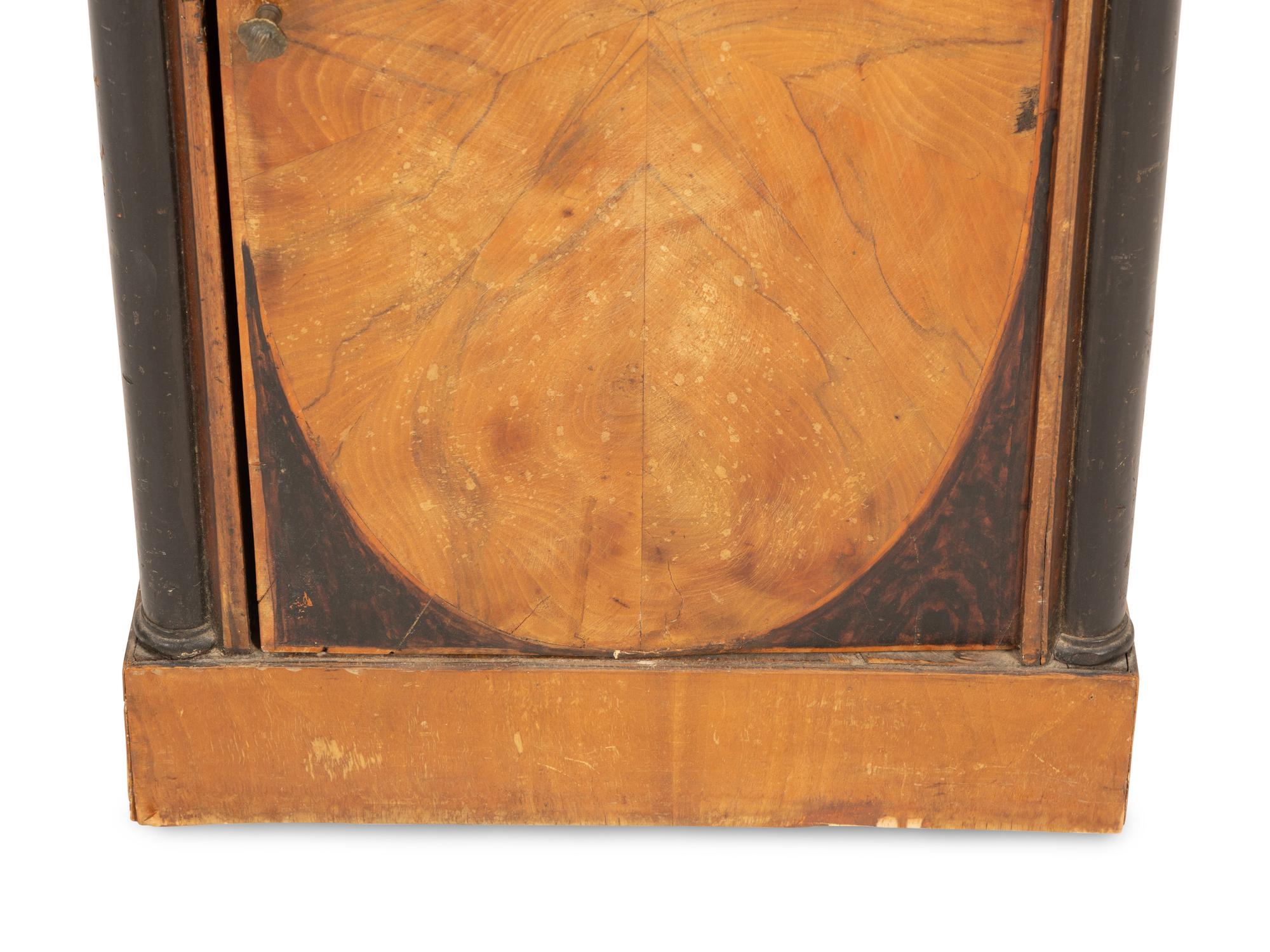 A Northern Italian Walnut and Ebonized Bedside Cabinet