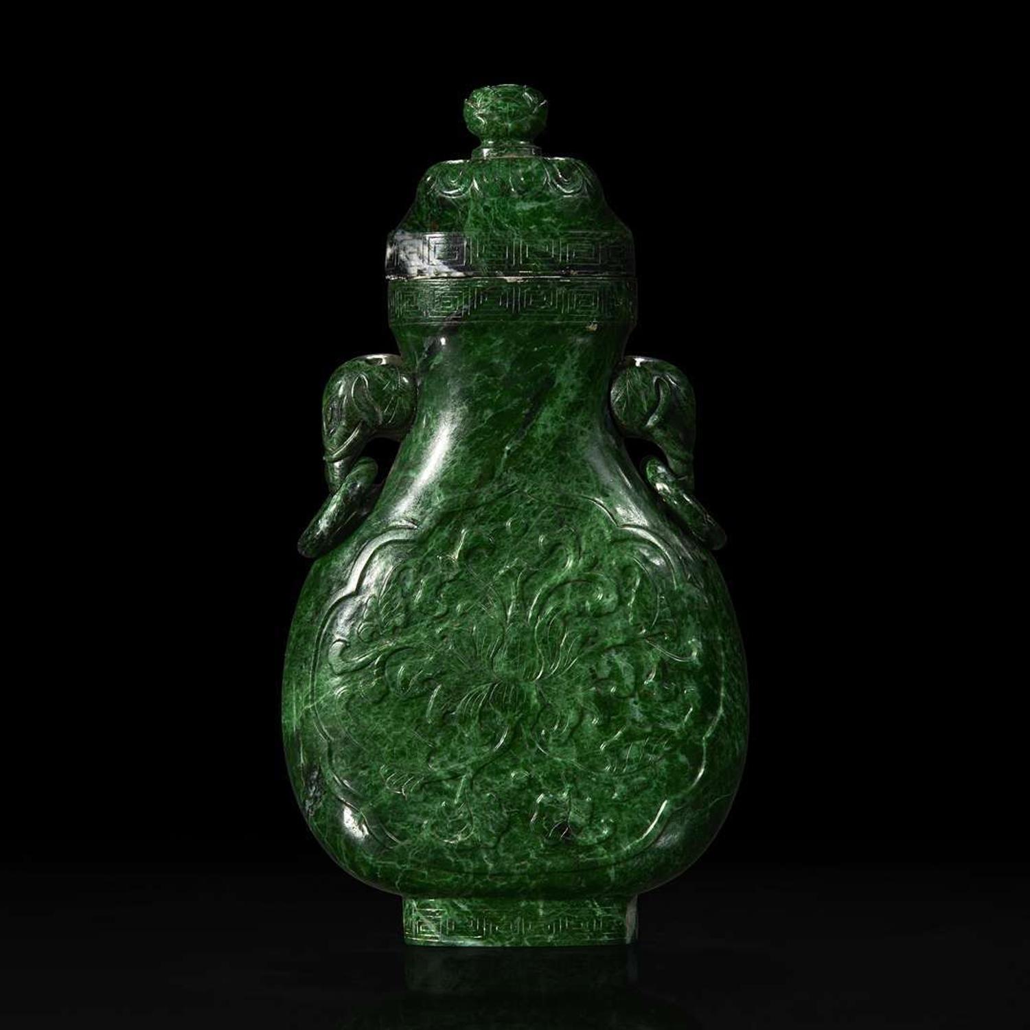 A Chinese carved chloromelanite vase and cover 玉盖罐