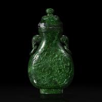 A Chinese carved chloromelanite vase and cover 玉盖罐