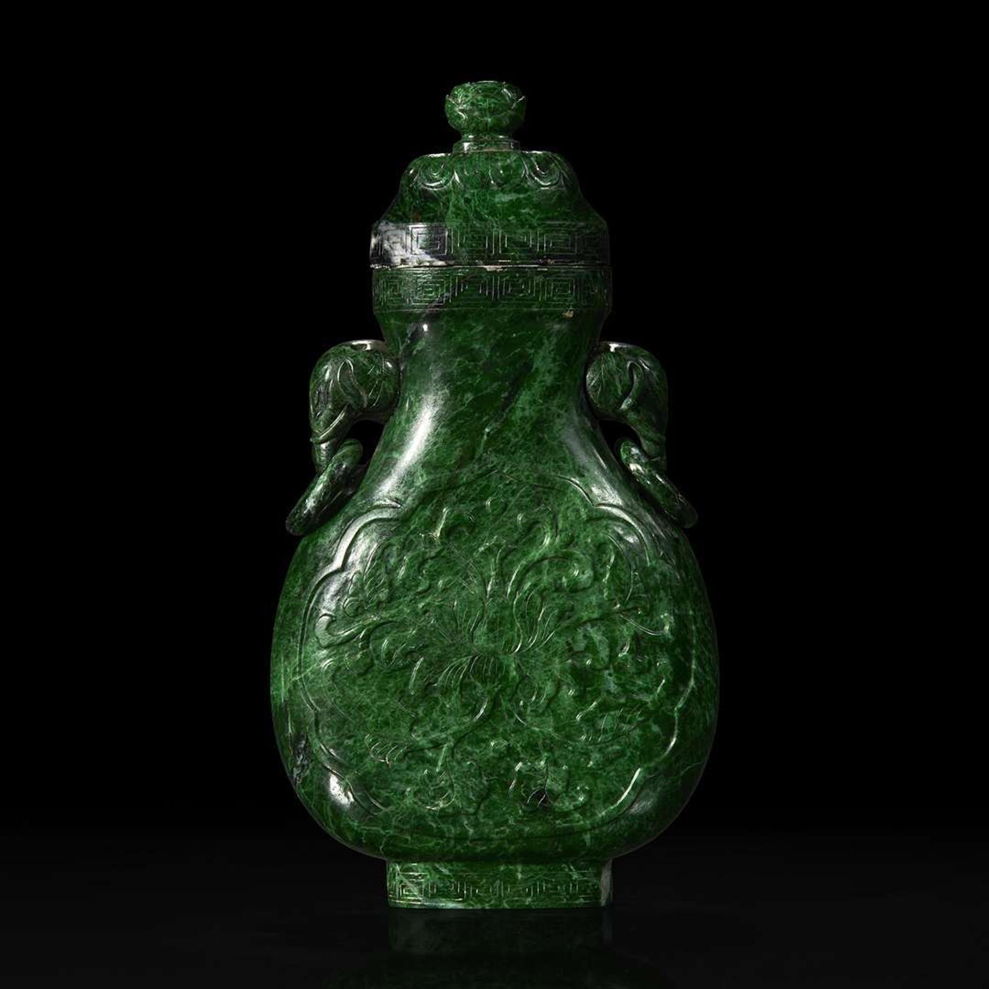 A Chinese carved chloromelanite vase and cover 玉盖罐
