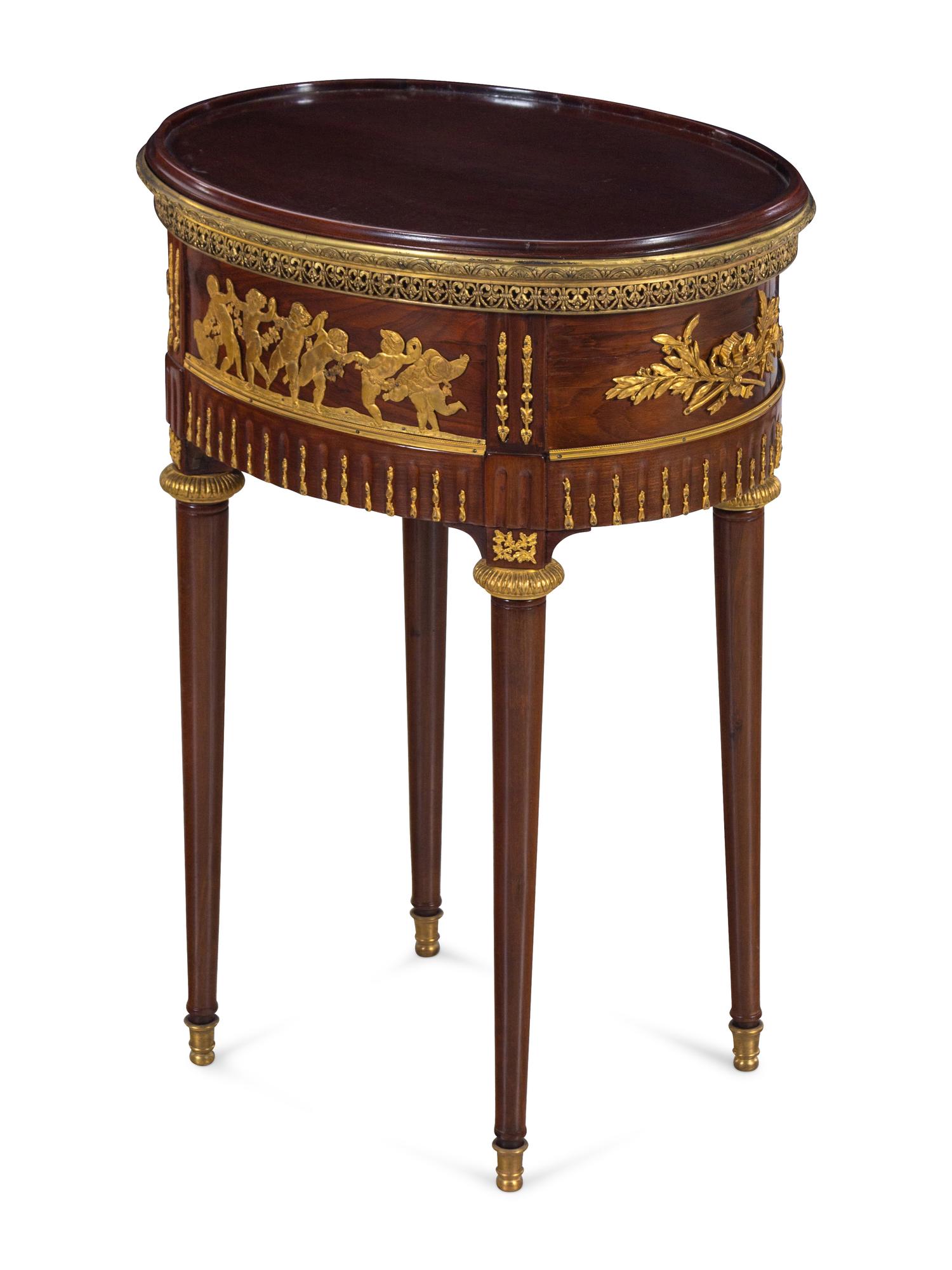 A Louis XVI Style Gilt Metal Mounted Mahogany Tray-Top Side Table