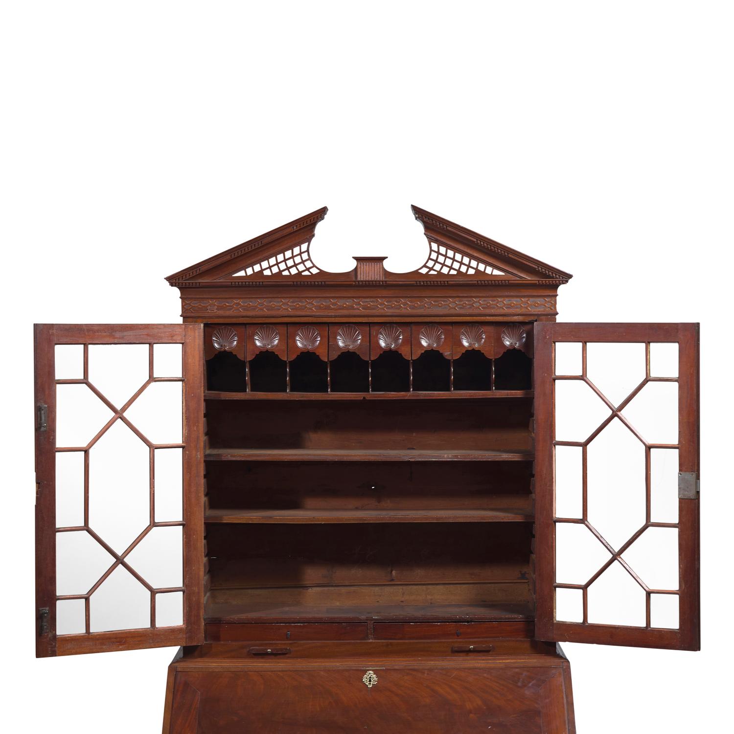 A Chippendale Carved Mahogany Desk-and-Bookcase