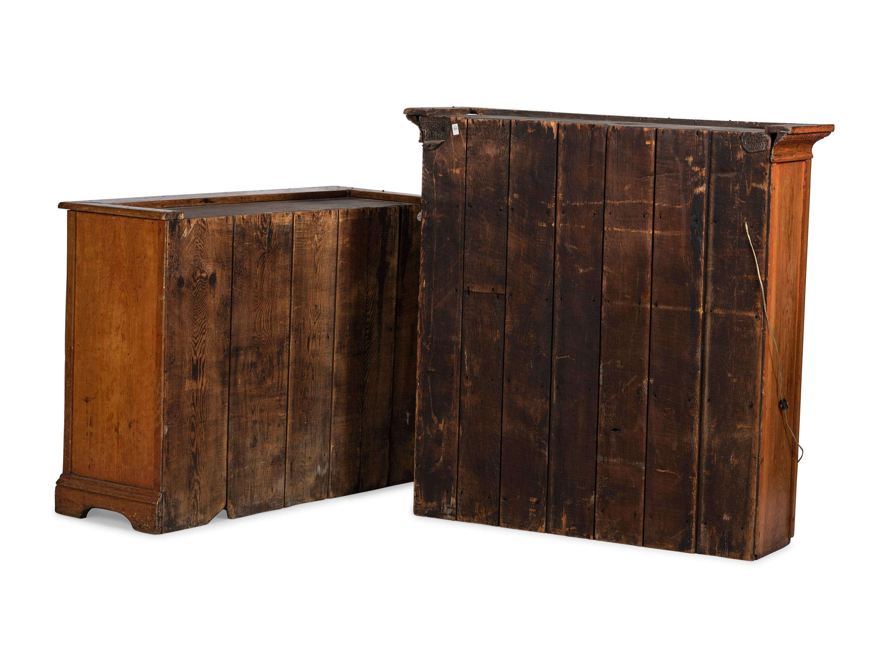 A Folk Art Carved and Paneled Pine Step-Back Cupboard