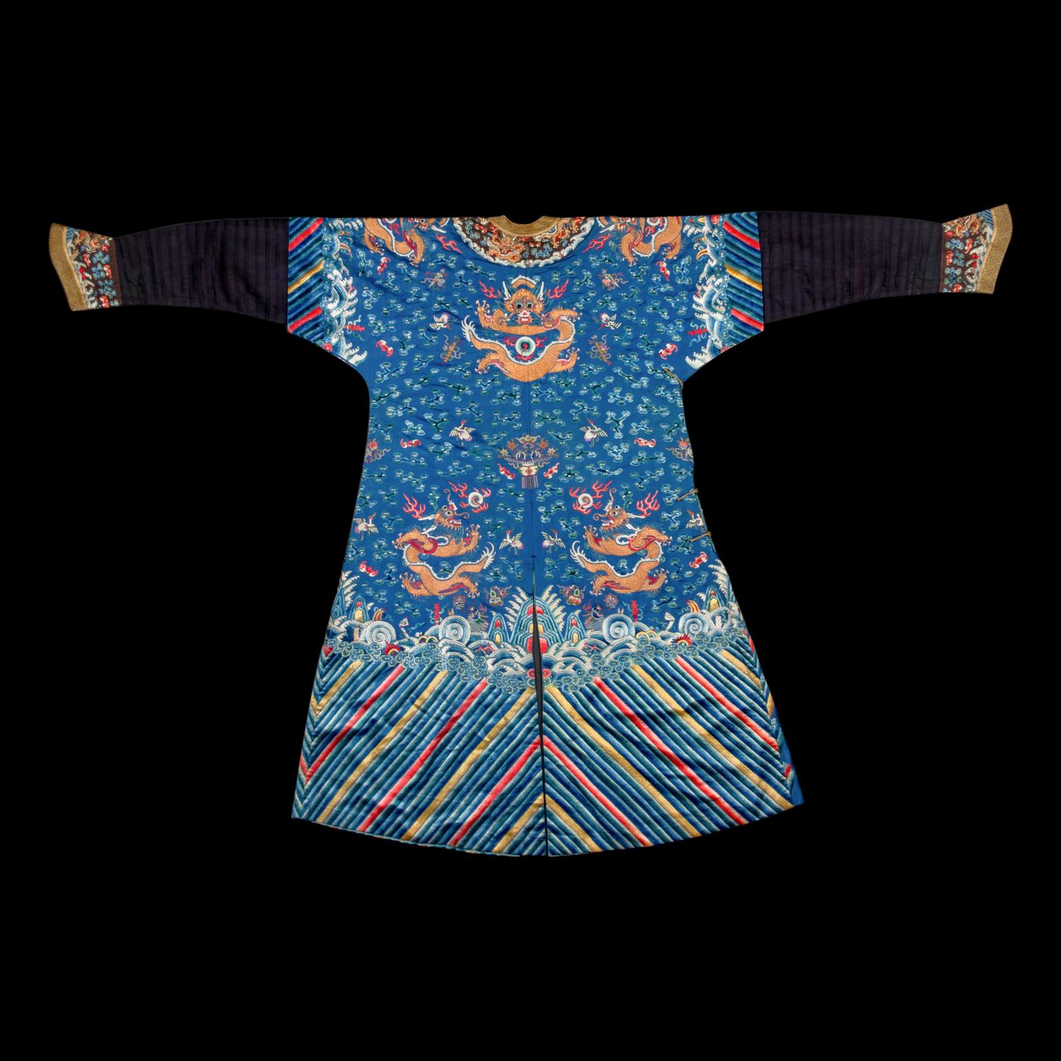 A Chinese Blue Ground Embroidered Silk 'Dragon' Robe, Jifu, 19th Century 清晚期 藍緞地綉云龍紋吉服