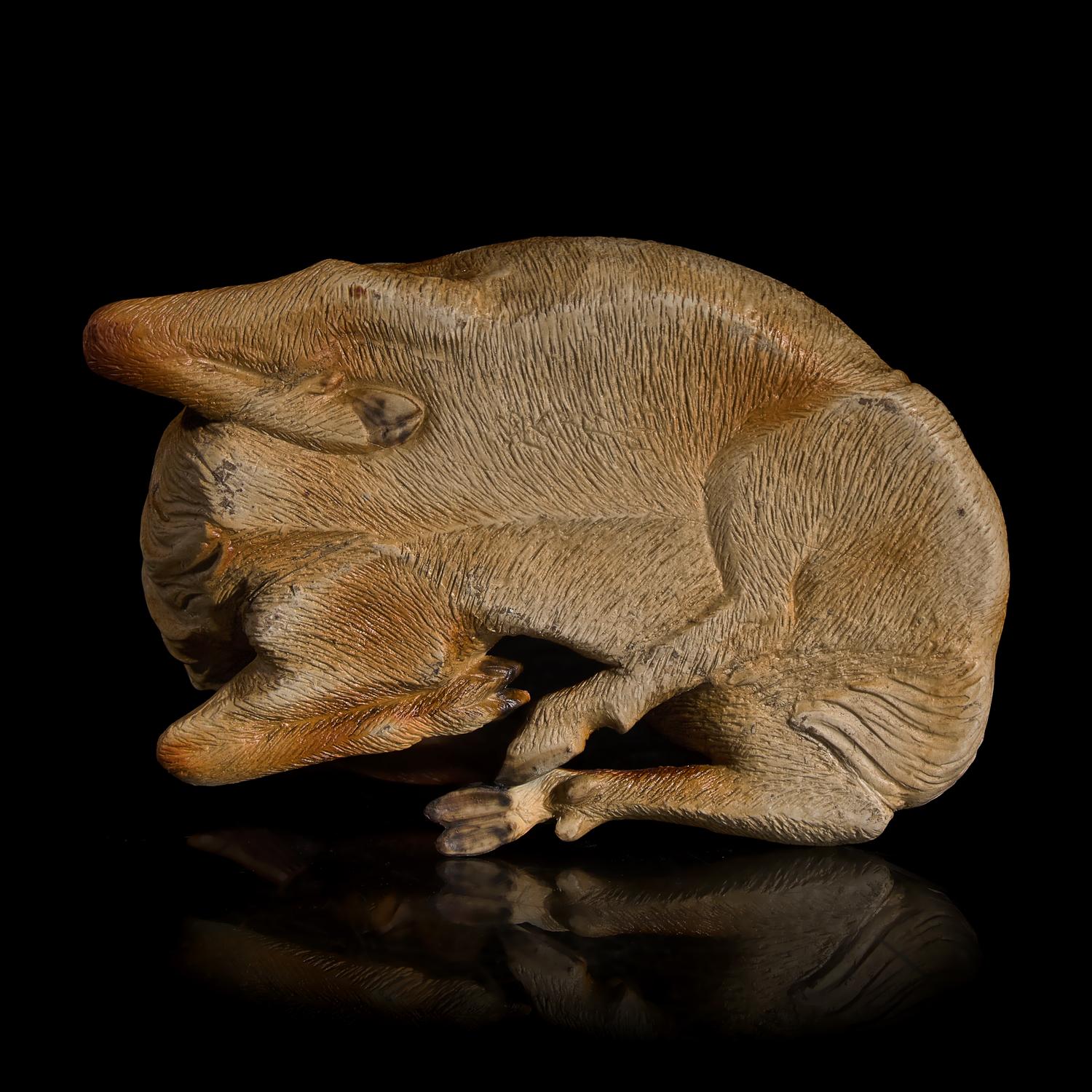 A Japanese Studio Ceramic Figure of a Recumbent Deer, Meiji/Taisho Period