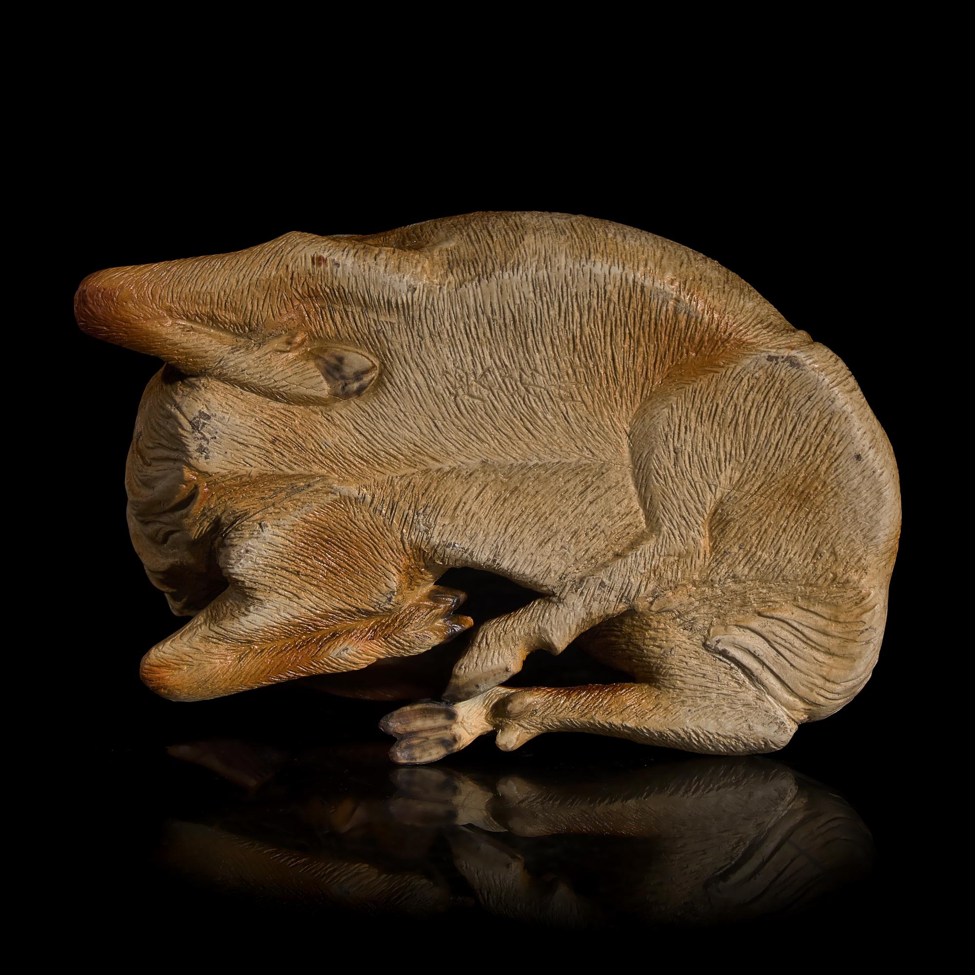 A Japanese Studio Ceramic Figure of a Recumbent Deer, Meiji/Taisho Period