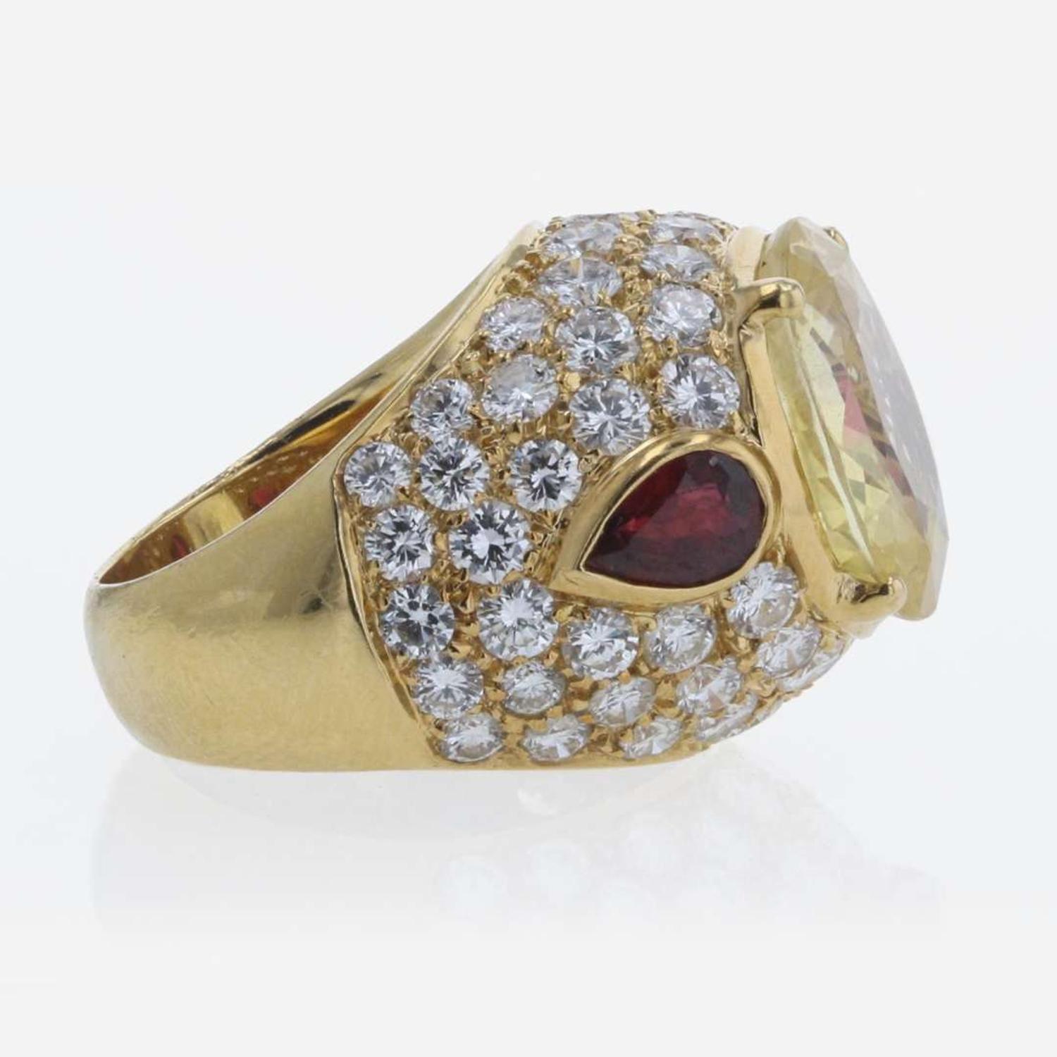 An 18K Yellow Gold and Gemstone Ring