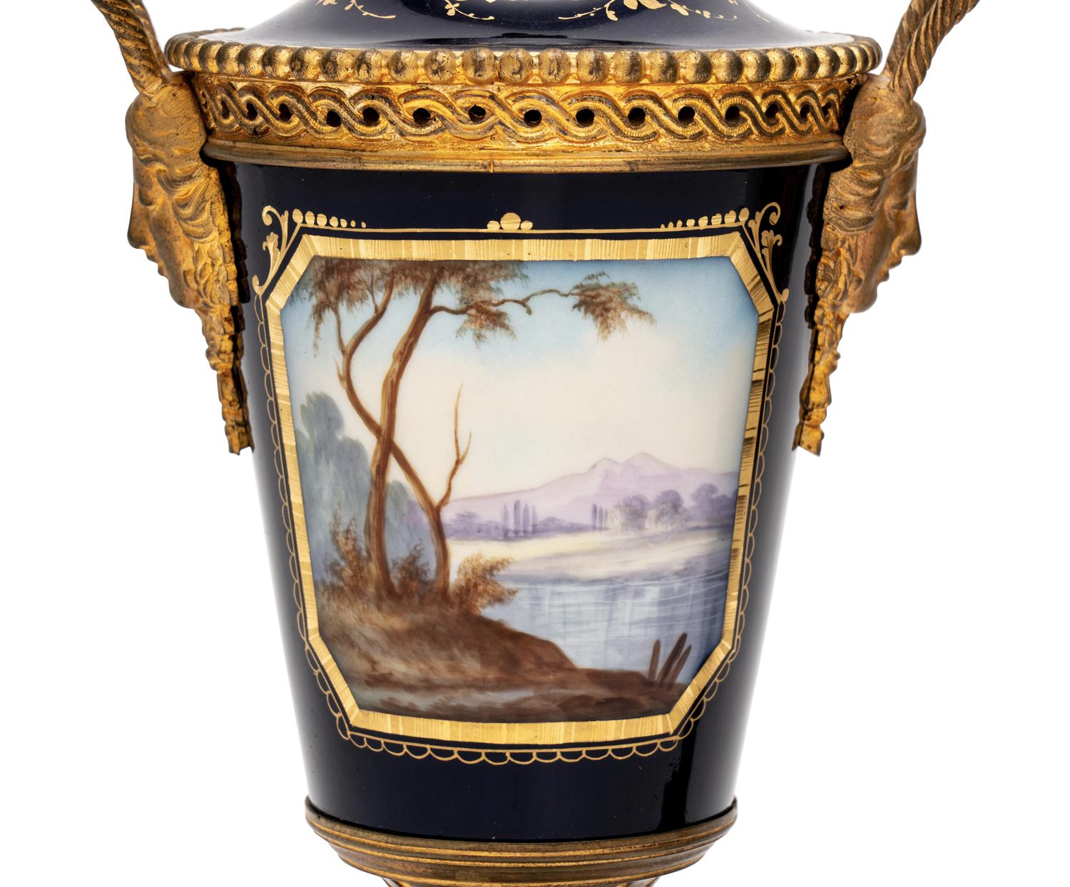 A Pair of Sèvres Style Gilt Bronze-Mounted Porcelain Urns